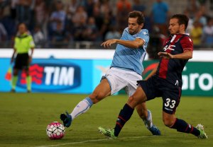 Lazio's Lulic challenges Brighi of Bologna during Italian Serie A soccer match in Rome