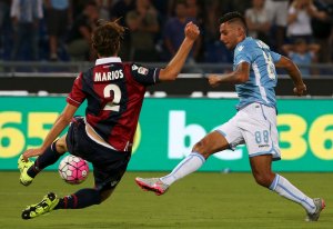 Lazio's Kishna kicks the ball as Morleo of Bologna tries to stop it during their Italian Serie A soccer match