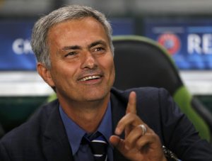 Chelsea's coach Mourinho waits for the kick off of their Champions League Group G soccer match against Sporting Lisbon at the Estadio Jose Alvade in Lisbon