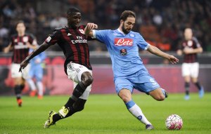 AC Milan's Zapata challenges Napoli's Higuain during their Italian Serie A soccer match at the San Siro stadium in Milan