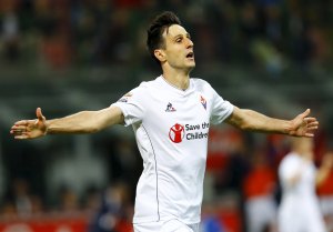 Fiorentina's Nikola Kalinic celebrates after scoring during the Italian Serie A soccer match against Inter Milan in Milan